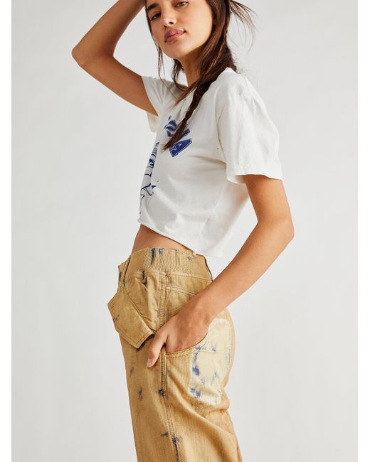 Free people mixed up cotton distressed utility jeans 2025
