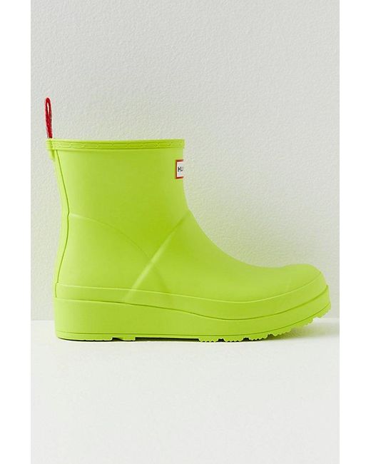 Hunter Play Short Wellies At Free People In Acid Green, Size: Us 8