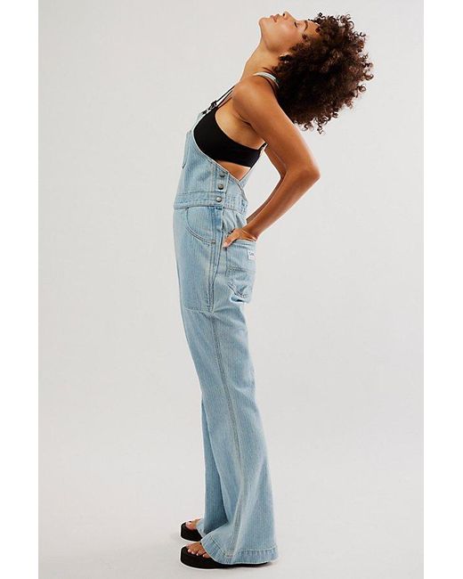 Lee Jeans Factory Flare Overalls At Free People In Vibrant Blues, Size: Xs