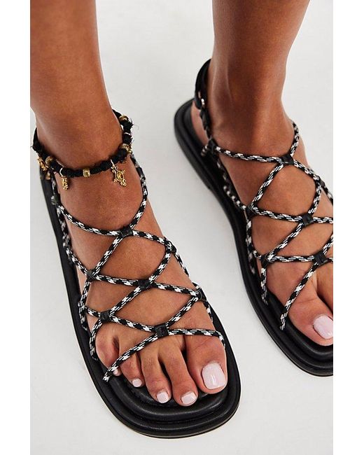 INTENTIONALLY ______ Black Bungee Strappy Sandals By