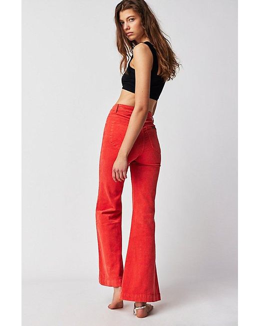 Rolla's Red East Coast Cord Flare Jeans At Free People In Blood Orange, Size: 28