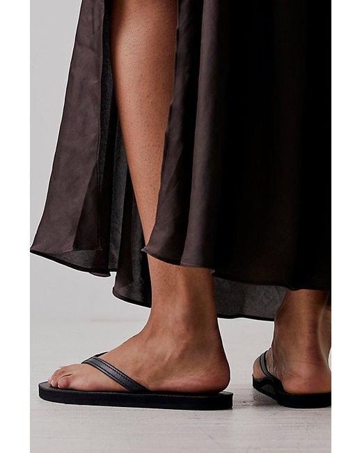 Rainbow Sandals Narrow Strap Flip Flops At Free People In Classic Black, Size: Small