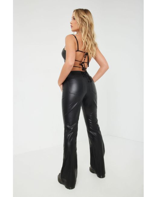 ASOS DESIGN low rise faux leather flare pants in black with