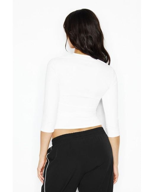 Garage White Sleek High V-Neck 3/4 Sleeve Top