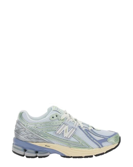New Balance White Low Top Sneaker With Logo Patch On Tongue And Side And Perforated Panels