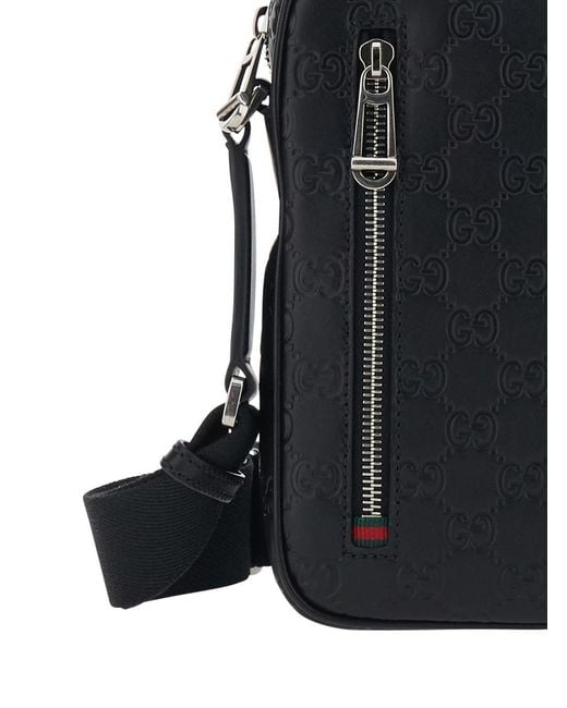 Gucci Black 'Emblem' Crossbody Bag With Adjustable Shoulder Strap And All-Over Embossed Gg Motif for men