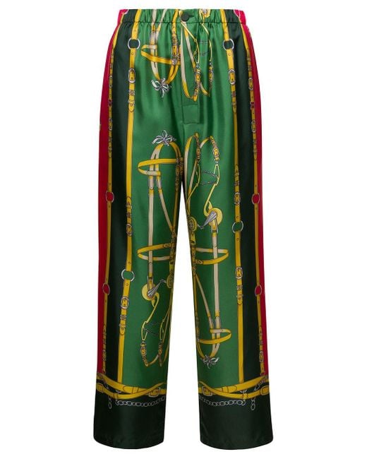 Pantaloni verdi in seta con stampa grafica di Gucci in Green