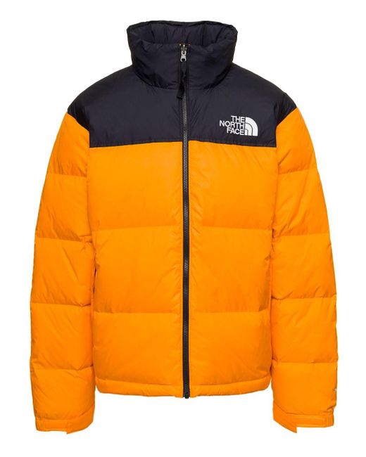 Piumino '1996 retro nuptse' trapuntato con logo in nylon ne brillante uomo di The North Face in Orange da Uomo