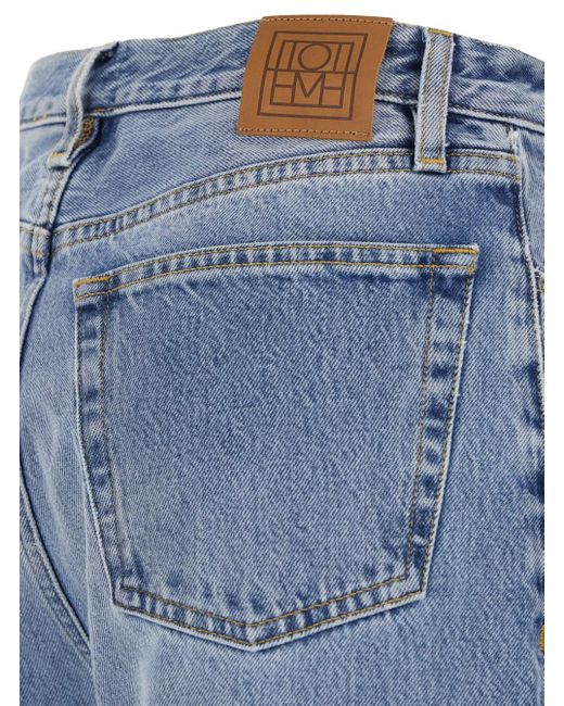 Totême  Blue Light High Waisted Jeans With Twisted Seam And Logo Patch On The Rear
