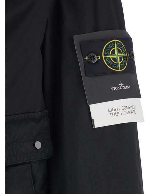 Stone Island Blue Jacket With Hood With Buttons And Logo Patch On The Sleeve for men