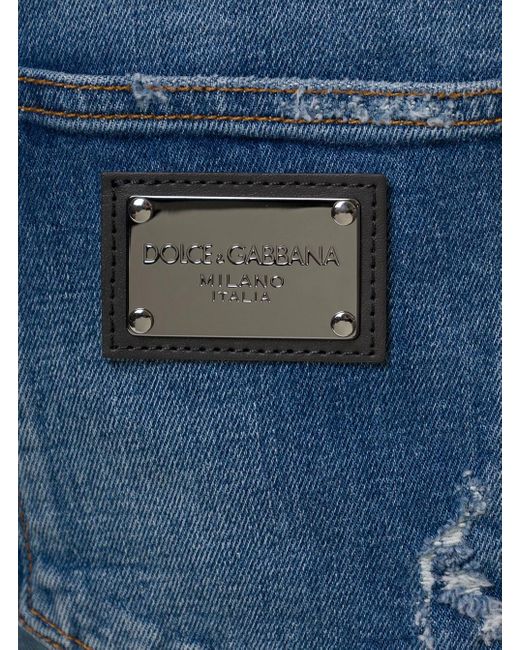 Jeans slim effetto usurato in denim di cotone stretch uomo dolce & gabbana di Dolce & Gabbana in Blue da Uomo