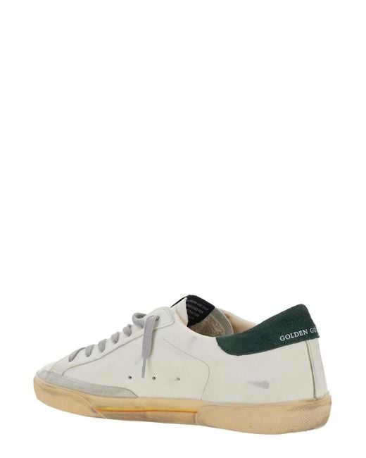 Golden Goose Deluxe Brand White 'Superstar' Low Top Sneakers With Contrasting Heel And Logo Patch On The Tongue for men