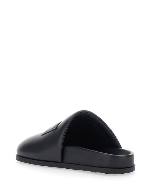 Givenchy Black Mules With Asymmetrical Design And Padded Leather Logo