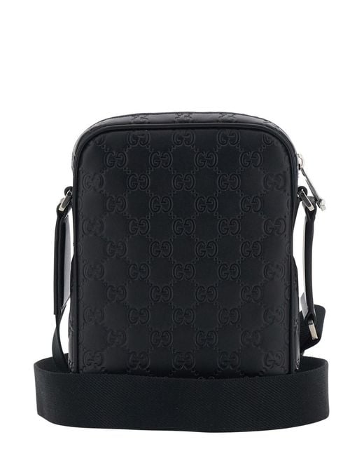 Gucci Black 'Emblem' Crossbody Bag With Adjustable Shoulder Strap And All-Over Embossed Gg Motif for men