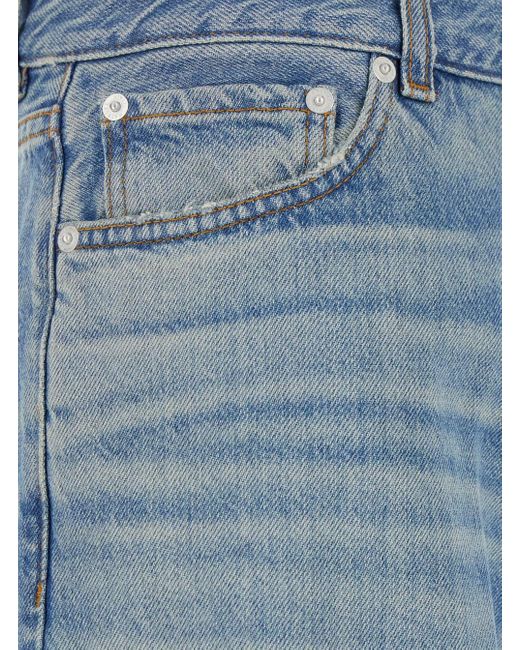Jeans A Cinque Tasche Con Patch Logo Sul Retro di Haikure in Blue