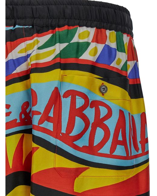 Pantaloncini con stampa carretto all-over in seta di Dolce & Gabbana in Multicolor da Uomo