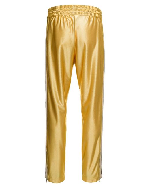 Pantaloni sportivi con nervature lucidi oro uomo moncler x palm angels da  Uomo di Moncler Genius in Giallo | Lyst
