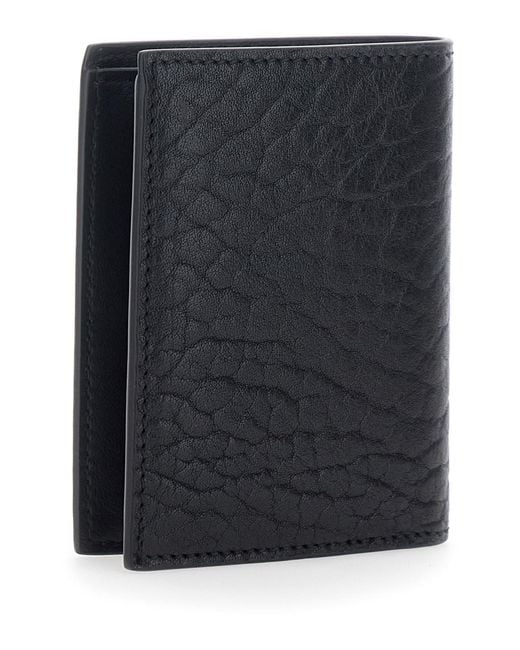 Ferragamo Black Bi-Fold Wallet With Gancini Plaque On The Front for men