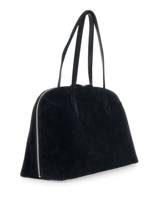 Totême Black Shoulder Bag With Embossed Logo Lettering On The Front In