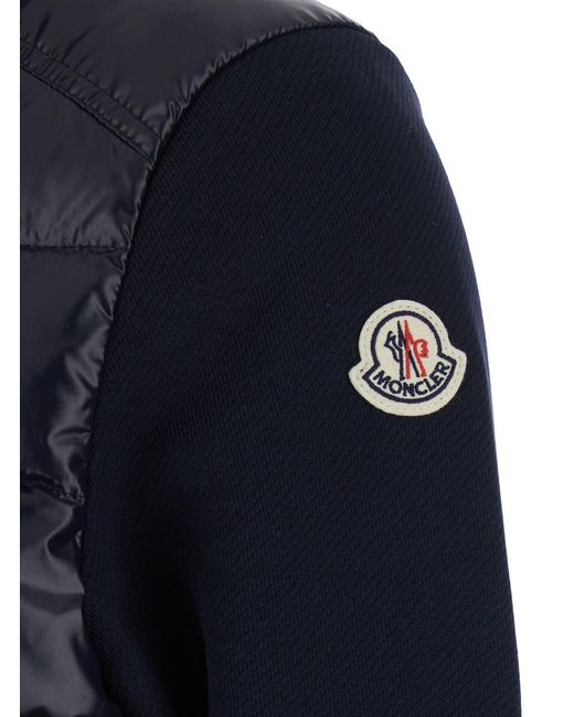 Moncler Blue High-Neck Cardigan With Logo Patch On The Sleeve And Padded And Quilted Design On The Front