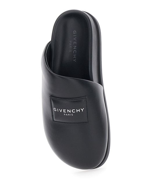 Givenchy Black Mules With Asymmetrical Design And Padded Leather Logo