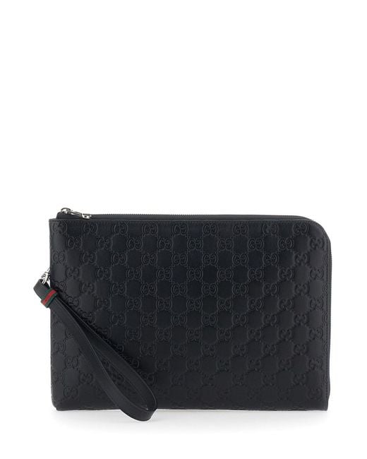 Gucci Black 'Emblem' Clutch Bag With All-Over Embossed Gg Logo for men