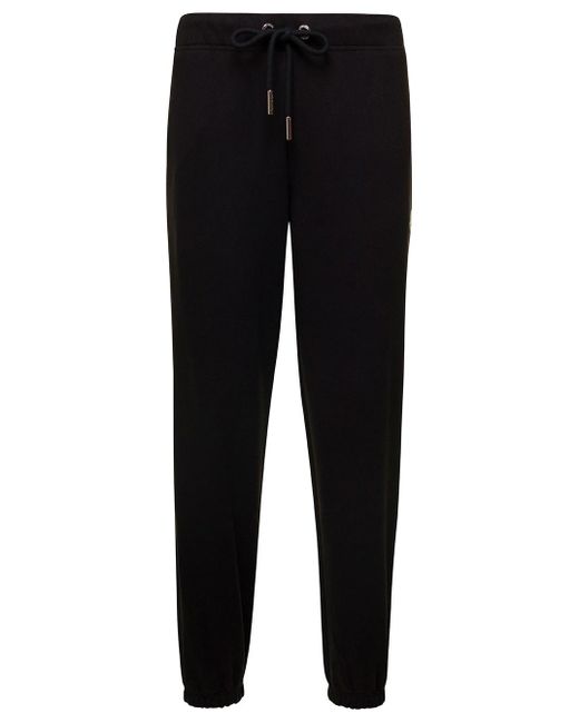 Pantalone da jogger con patch logo in cotone uomo di Moncler in Black