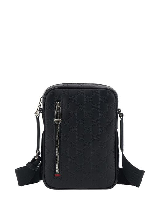 Gucci Black 'Emblem' Crossbody Bag With Adjustable Shoulder Strap And All-Over Embossed Gg Motif for men