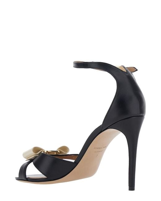 Ferragamo Metallic 'Vara' Heeled Sandal With Bow Detail On The Front