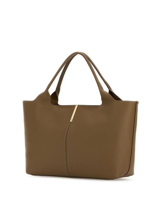 Esterno: 100% Vitello Fodera: 100% Pelle scamosciata Finitura: Metallo dorato di Tod's in Brown