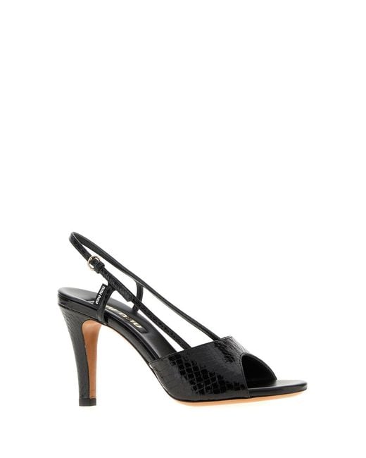Sandali in pelle nera di Miu Miu in Black