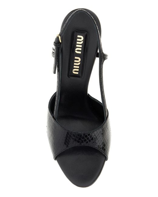 Sandali in pelle nera di Miu Miu in Black