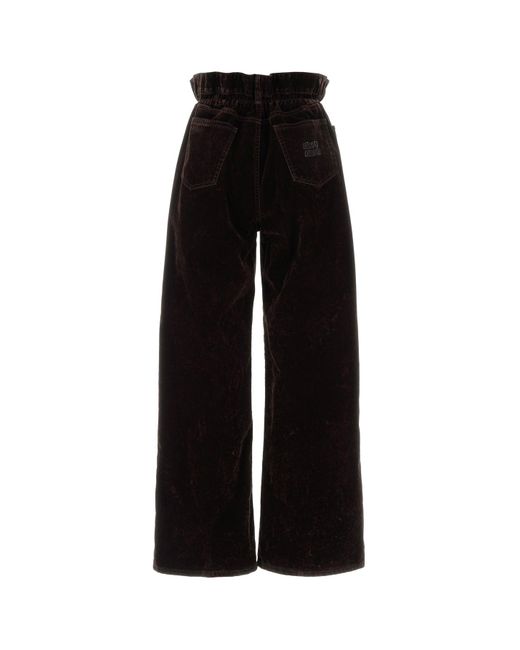 Pantalone dalla gamba ampia in velluto testa di moro di Miu Miu in Black