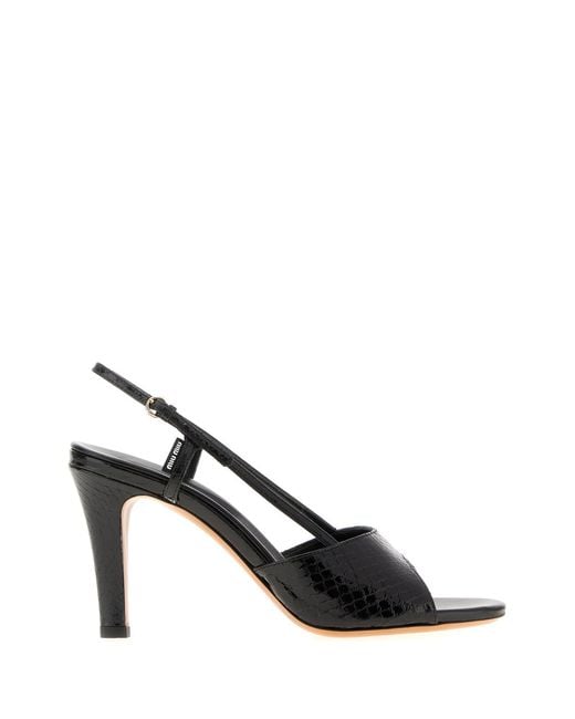 Sandali in pelle nera di Miu Miu in Black