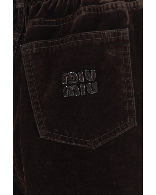Pantalone dalla gamba ampia in velluto testa di moro di Miu Miu in Black