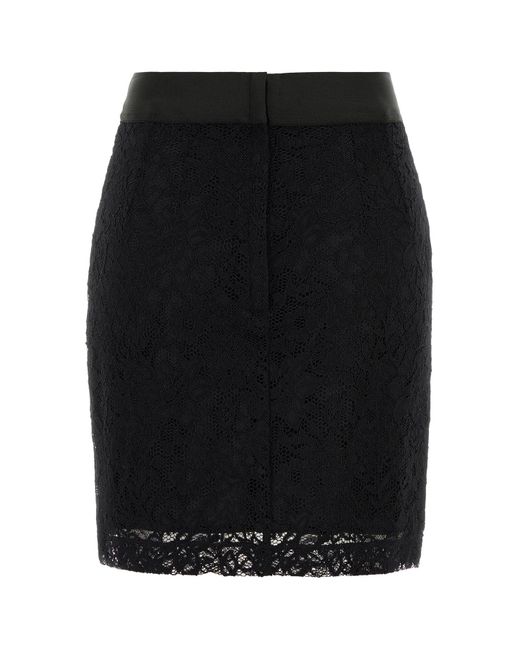 Minigonna in pizzo stretch nero di Dolce & Gabbana in Black
