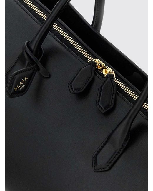 Alaïa Black Delta Medium Calfskin Leather Handbag With Logo Charm