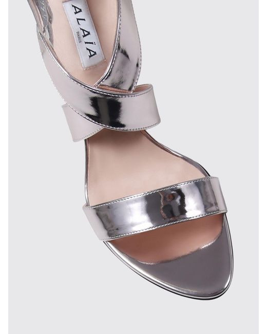 Alaïa White Patent Leather Sandals With A High Cone Heel And An Ankle Strap