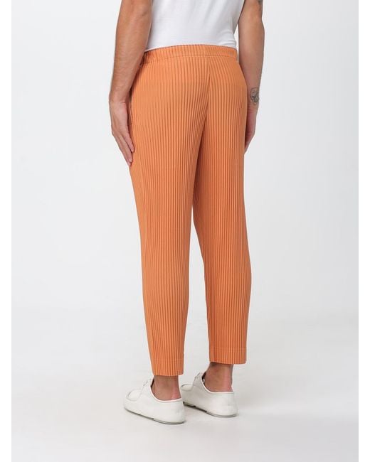 Homme Plissé Issey Miyake Orange Pleated Crepe Trousers for men
