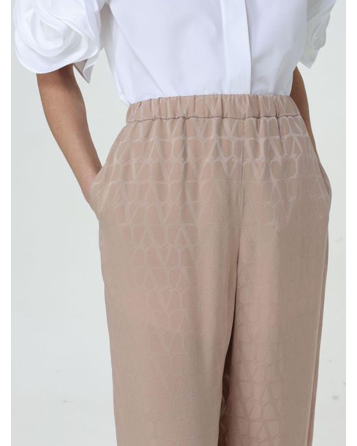 Pantalone in seta con monogram all over di Valentino in Natural