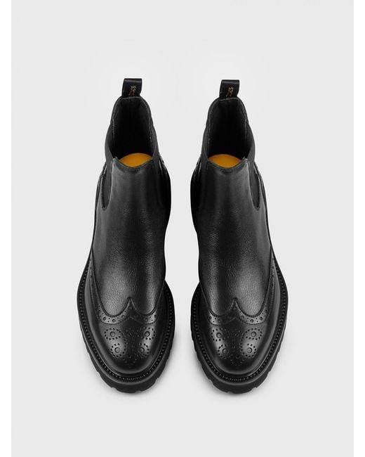 Doucal's Black Leather Ankle Boots With Brogue Motif
