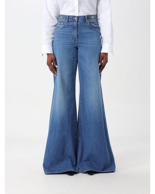 Jeans a zampa in denim di Versace in Blue