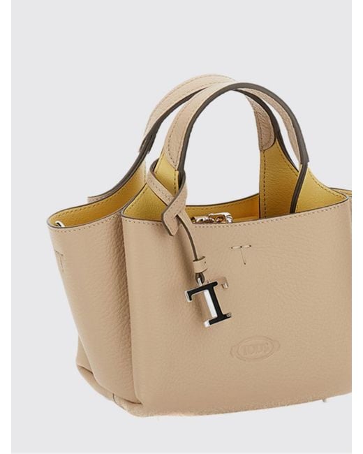 Tod's Natural Small Grained Leather Handbag With Flared Design And Charm