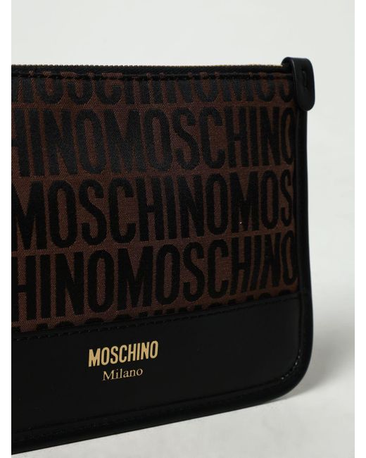 Clutch in pelle e tessuto jacquard di Moschino Couture in Black