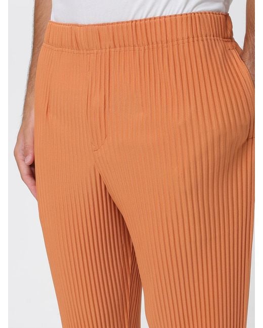 Homme Plissé Issey Miyake Orange Pleated Crepe Trousers for men