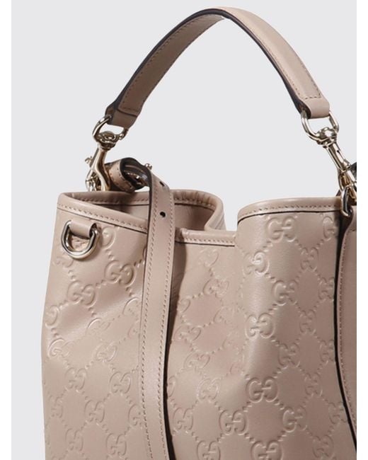 Gucci Natural Gg Emblem Leather Bucket Bag With Embossed Gg Monogram
