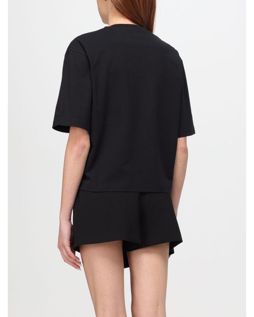 T-shirt in cotone con logo ricamato di Moschino Couture in Black