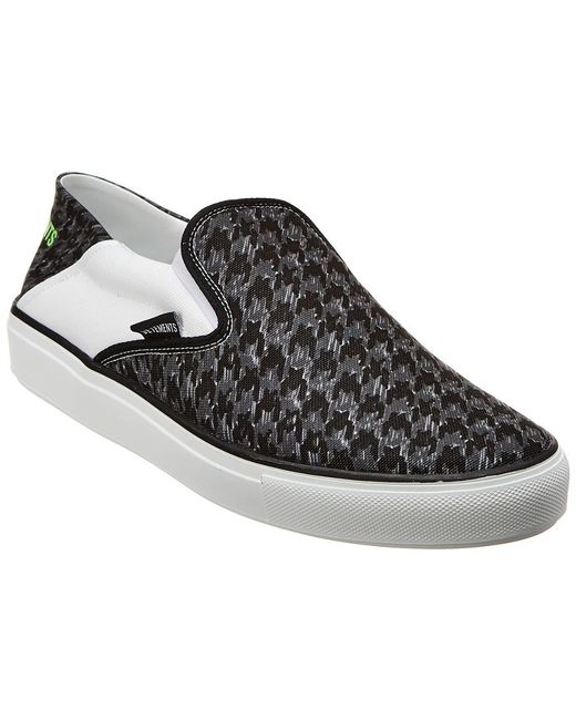 black canvas slip on sneakers