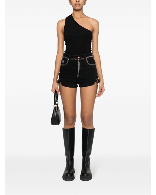 Shorts denim con logo goffrato di Versace in Black