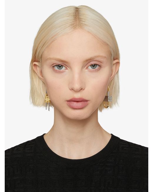 Givenchy White Lock Asymmetrical Earrings